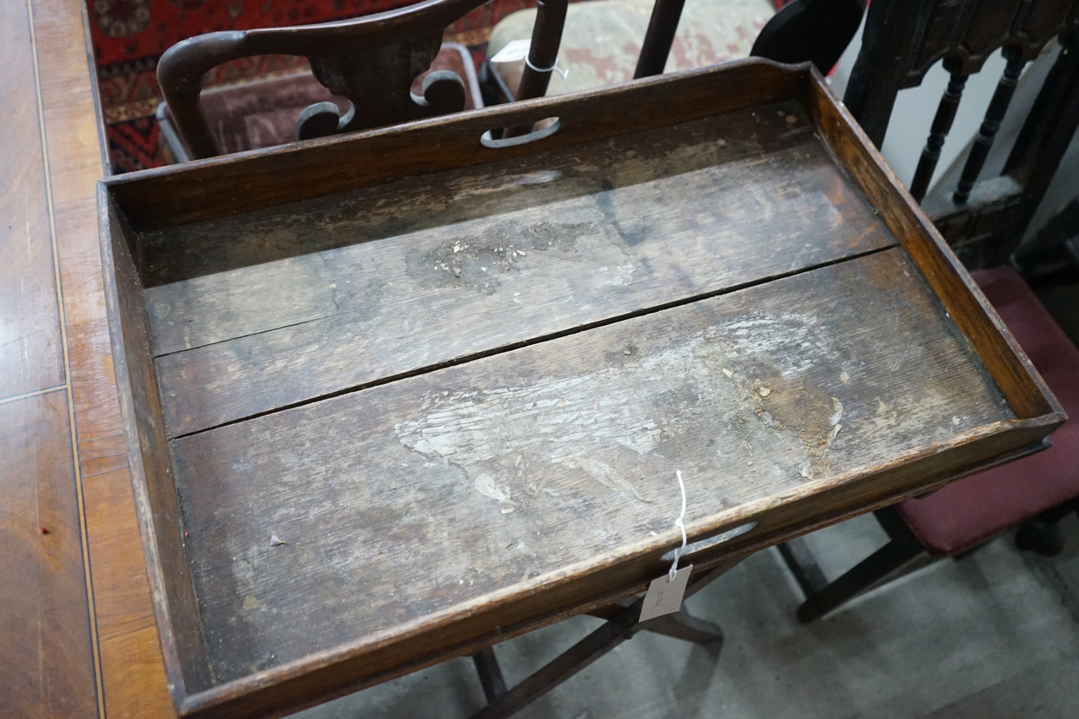 An early 18th century style oak joint stool, width 46cm, depth 30cm, height 38cm and a Victorian butler's tray on stand